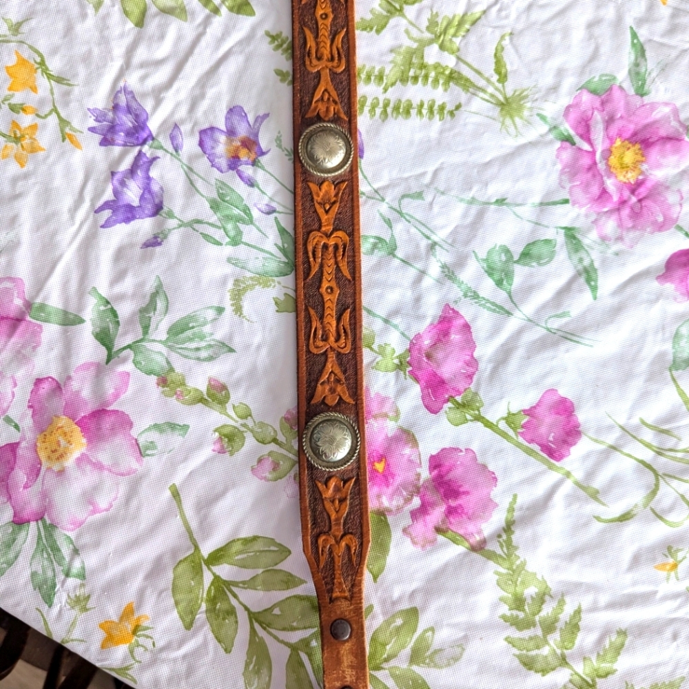Beautiful hand carved belt or headband. Four silver conchos silver plated tip